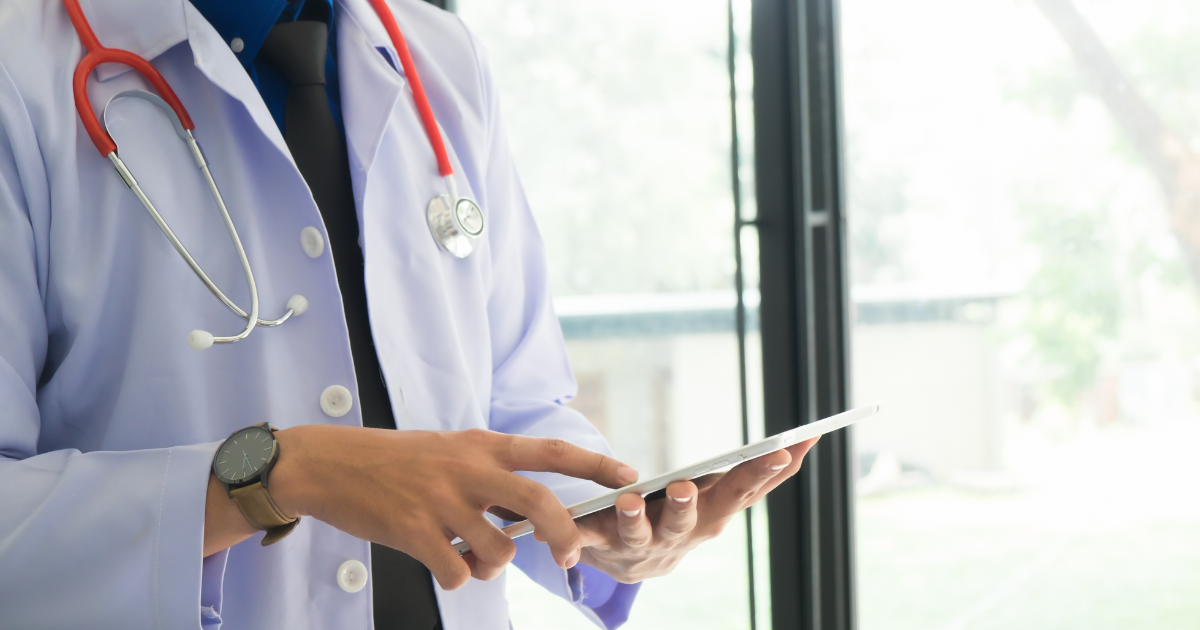 Concierge doctor using tablet for personalized primary care in Las Vegas